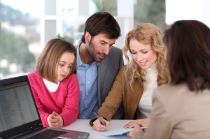 Couple-and-child-buying-house---Stock-Image